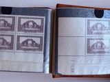 a book with stamps on it sitting on a table