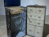 two pieces of luggage sitting next to each other on the floor