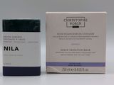 a picture of a bottle of nila cosmetics next to a box