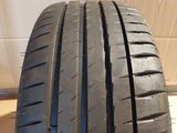 a close up of a tire on a wooden surface