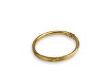 a close up of a gold ring on a white background