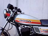 a motorcycle that is parked in front of a wall
