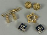 four pairs of gold and silver jewelry including a star of david, a star of david, a star of david, and a star of david
