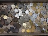 a lot of coins in a box on the table