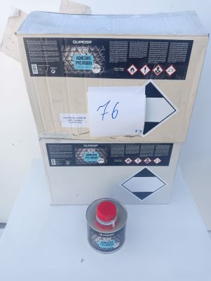 a box with a sign and a can of paint on it