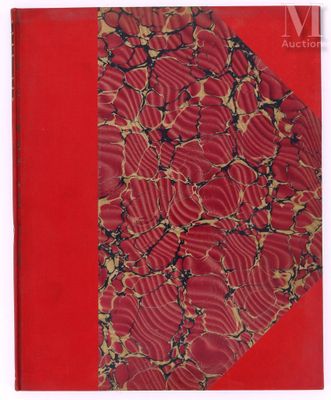 an old book with a red cover and a pattern on it