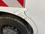 a close up of a white truck with a red stripe on it