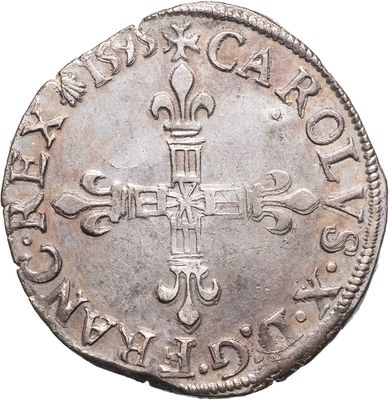 une vieille pièce d'argent ornée d'une croix