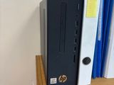 a desktop computer sitting on top of a wooden desk