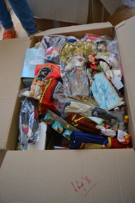 a cardboard box full of toys and other items