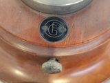 a close up of a wooden lamp on a table