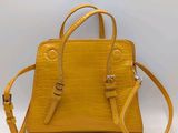 a small yellow handbag with a strap and a shoulder strap