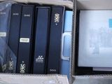a lot of books in a box on the floor