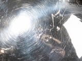 a person holding a large metal object in their hand