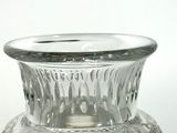 a glass vase that is sitting on a table