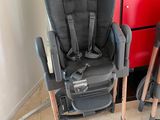 two baby chairs that are next to each other on the floor