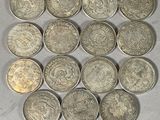 a close up of a bunch of coins on a table