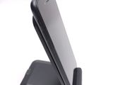 a cell phone that is sitting on top of a stand