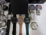 a lot of watches that are sitting on a table