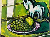 a painting of a cat sitting on a plate of fruit