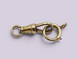 a close up of a gold plated clasp on a white background