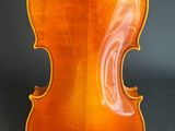 an old violin with a very long neck and a very long back