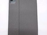 the back of a gray case that is open on a white surface