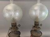 two lamps that are sitting on a table