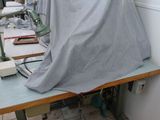 a table covered with a sheet in a room
