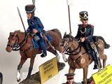 many figurines of soldiers on display on a table
