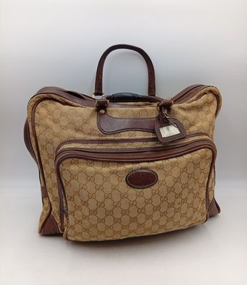 Sac de voyage en toile et cuir « guccissi gg »