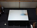 overhead view of a projector screen with a projector screen in the middle of the room