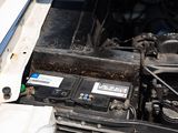 a close up of a car ' s engine with its hood open