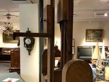 a clock on the wall in the middle of a room