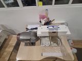 a table that has a sewing machine on top of it