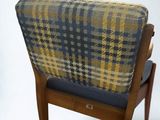 an image of a chair with a plaid upholstered back