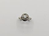 a white gold ring with a round brilliant cut diamond