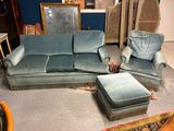a couch, chair, ottoman, and ottoman in a room