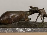 statue of a goat and a baby goat on a marble base