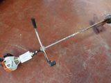 an image of a string cutter laying on the ground