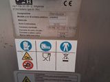 an image of a stainless steel refrigerator with labels on it