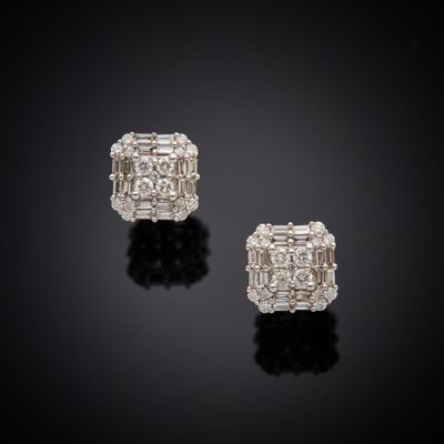 a pair of diamond earrings