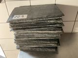 a stack of paper sitting on top of a metal counter