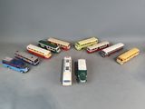 a lot of toy buses and cars on a table