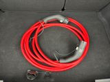 a red hose in the trunk of a car