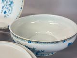 two bowls and a bowl sitting on a table
