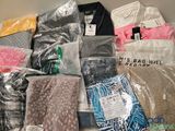 a pile of clothing that is sitting on a table