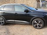 a picture of a black car parked in a parking lot