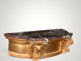 a gold and black marble table on a white background