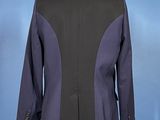 the back of a black and purple jacket on a mannequin mannequin mannequin mannequin mannequin mannequin mannequin mann